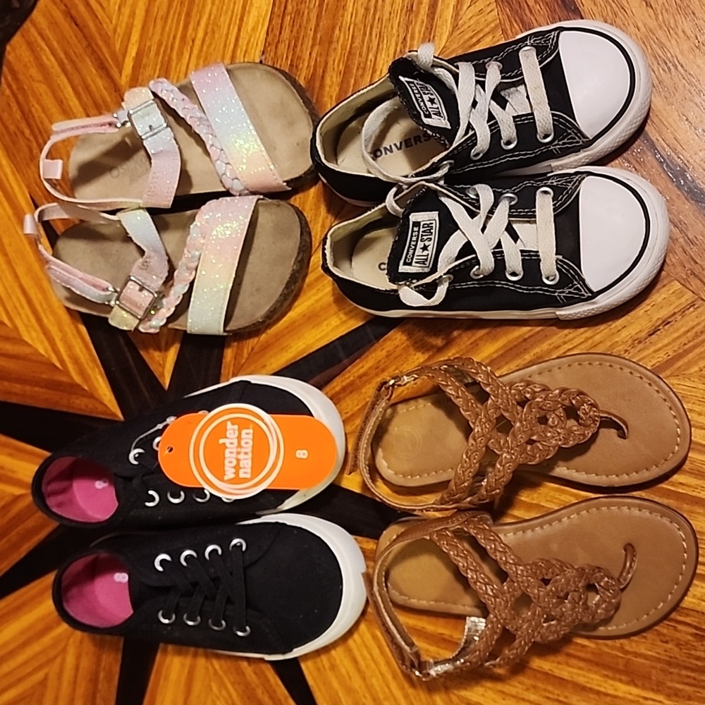 This is a lot of four pairs of girl toddler shoes.
